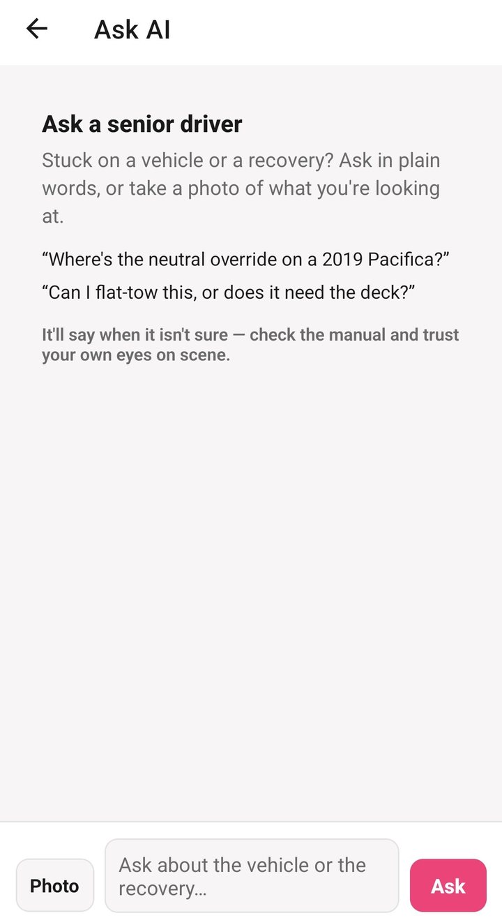 The Ask AI screen on a driver's phone, headed Ask a senior driver: a question box with examples about a neutral override and whether a vehicle can be flat-towed, and a note that it says when it isn't sure.