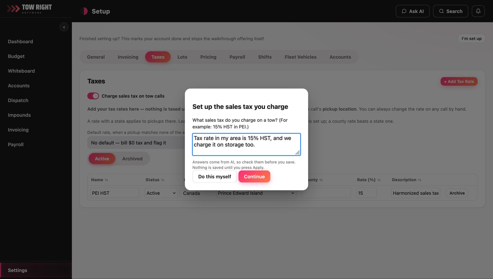 On the tax setup screen, a dialog asking what sales tax you charge on a tow, with the answer typed in plain words — fifteen percent HST, charged on storage too — and a note that nothing is saved until you press Apply.